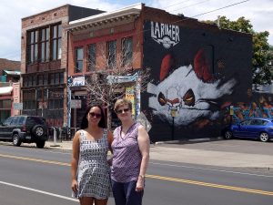 Louise M. from Griffith, Australia and Greeter Diane enjoying some of the urban art around the RiNo Art District.